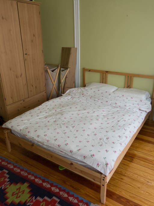 Full-size bed & wardrobe.