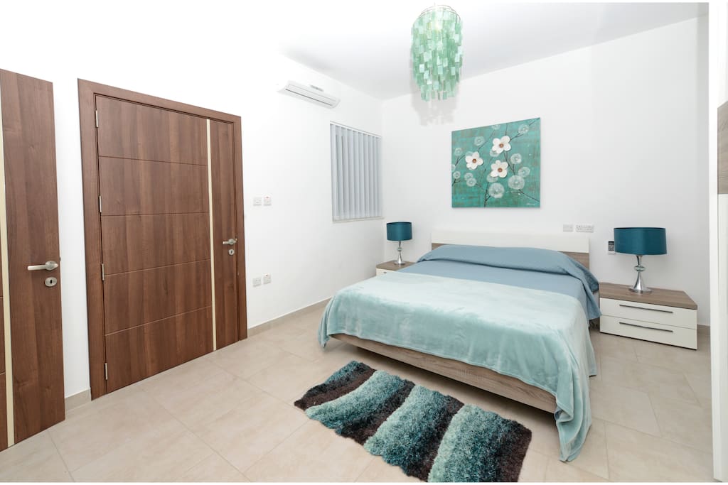 Main Bedroom with a King Size Bed, AC unit and en-suite