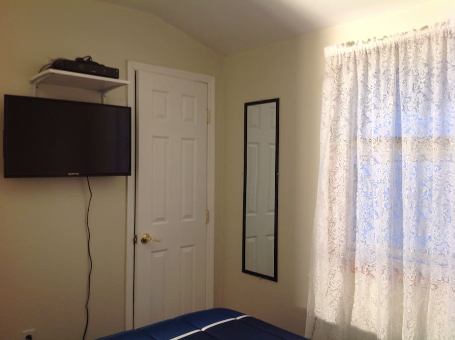 Television and full size mirror.