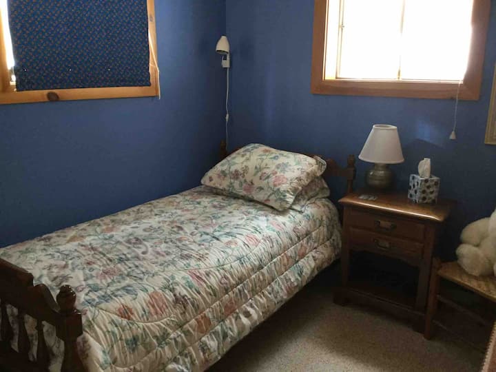 Little bedroom with big closet in which are the electric panel