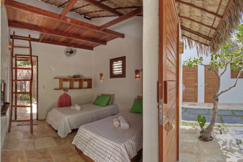 One of the bungalows with possibility of double queens bed or 2-3 single beds, the mezanine can be a great spot for a 3rd person or a child ... accessible by the ladder.