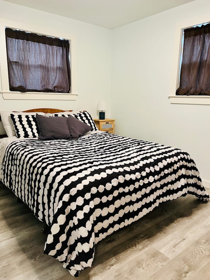 Primary Bedroom with Queen Bed and Ensuite Bathroom 