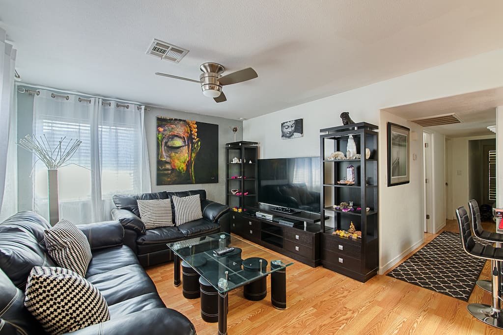 A huge 70 inch huge tv in living room is perfect for relaxation and enjoying films together