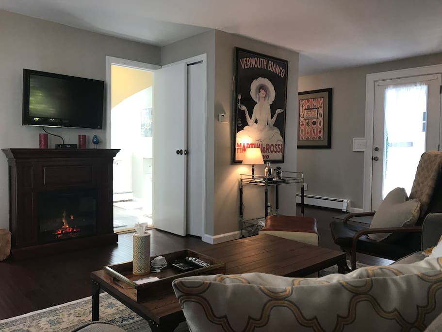 Living room with electric fireplace and wall mounted TV