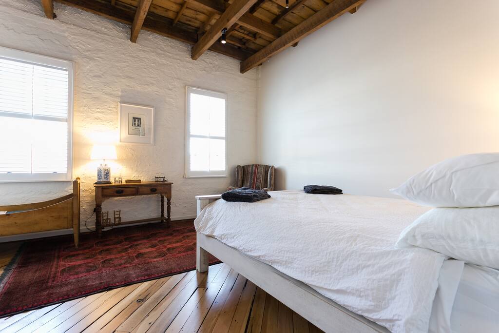 Easterly aspect with lovely windows, small desk, free wifi, arm chair, polished floor boards and Persian rugs make it very cosy .
