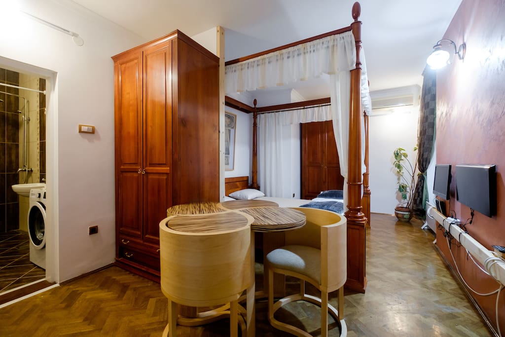 Hand-crafted wooden table and baldachin bed