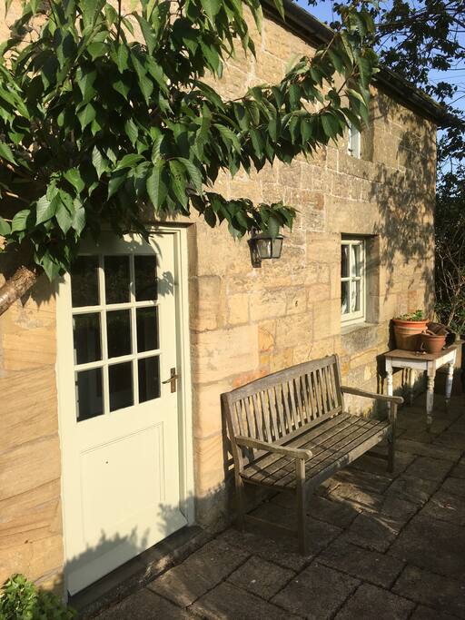 Own entrance and outside seating looking onto the garden