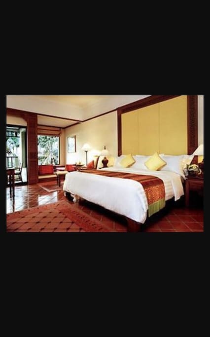 Master bedroom with king size bed.