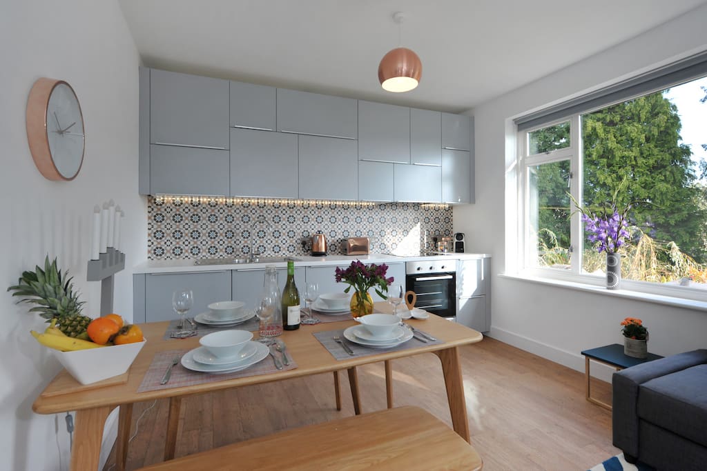 Light open plan kitchen-diner at the back with stunning views across to Bathford village