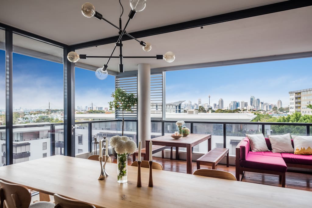Views of the Anzac bridge, CBD and University of Sydney, from the 3-metre American oak dining table