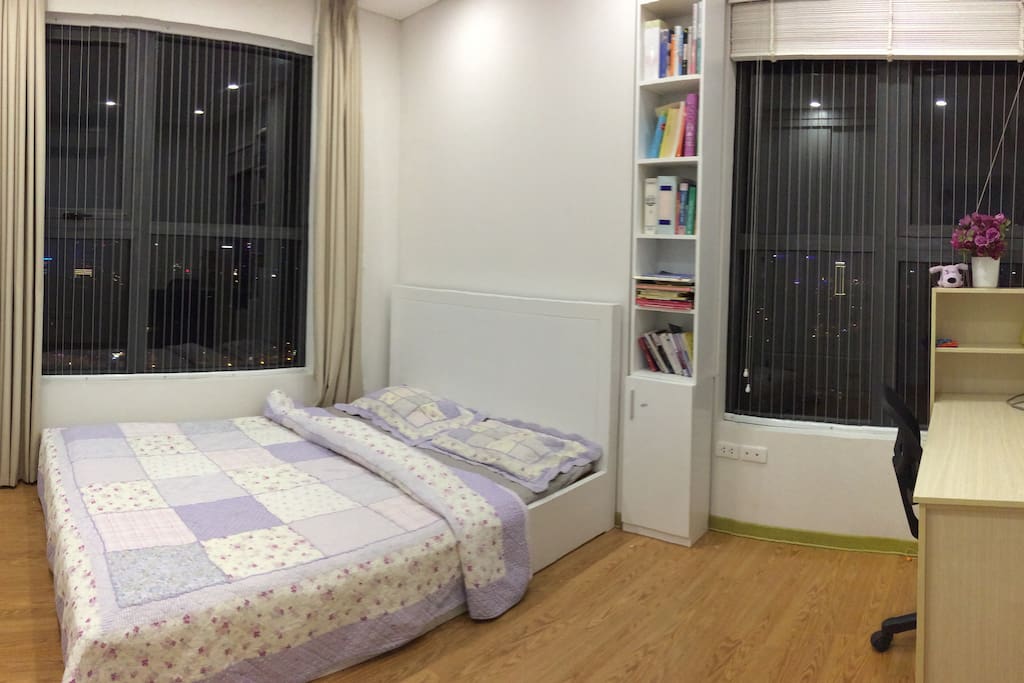 Bedroom 1 with air-conditioner, 2 windows, 1 bed, 1 desk and chair and big closet