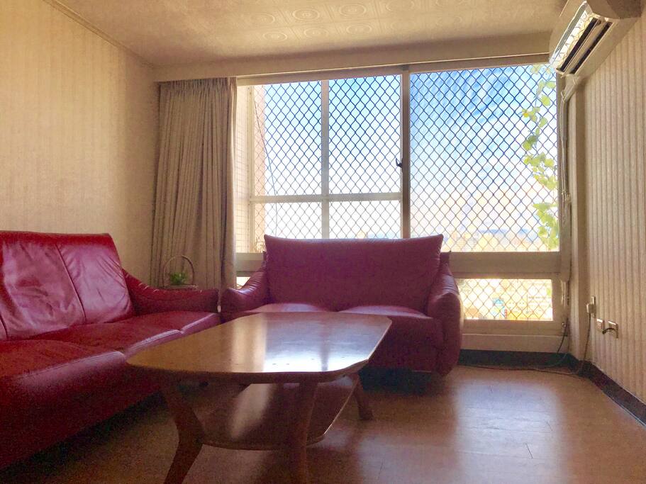 living room with a set of cozy red sofa and a nice view