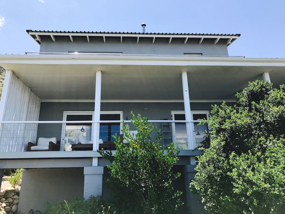 The house faces west/the sea with decks on both floors.