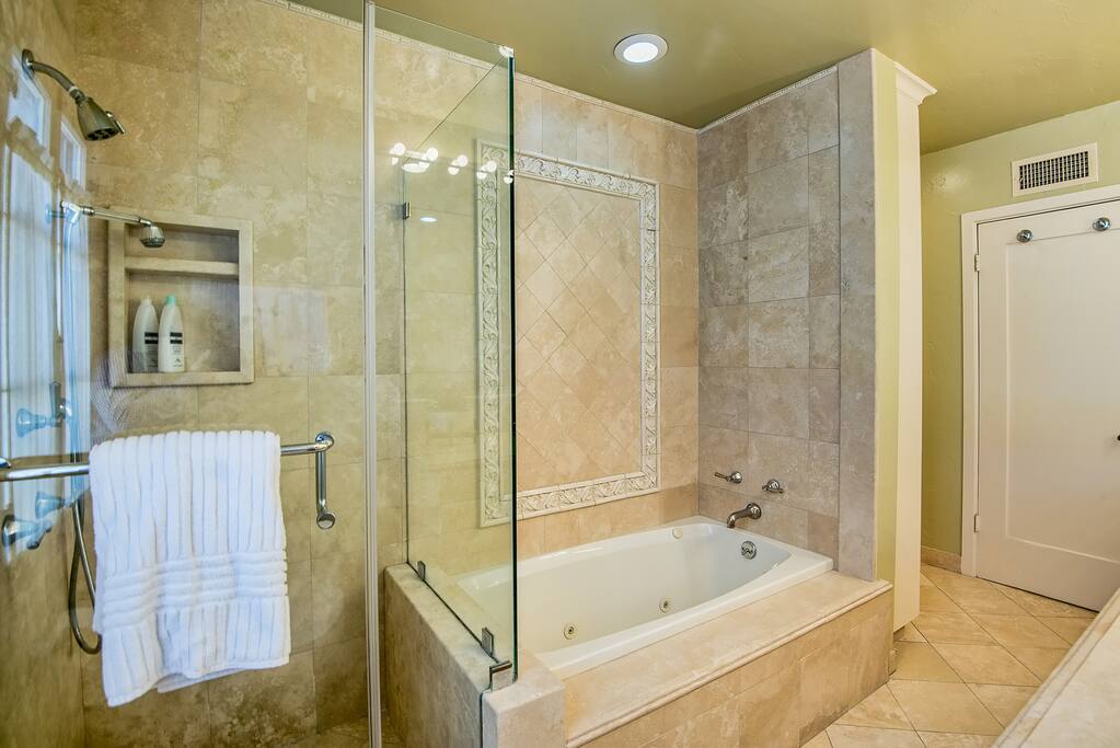 Shower and jacuzzi tub in private bathroom