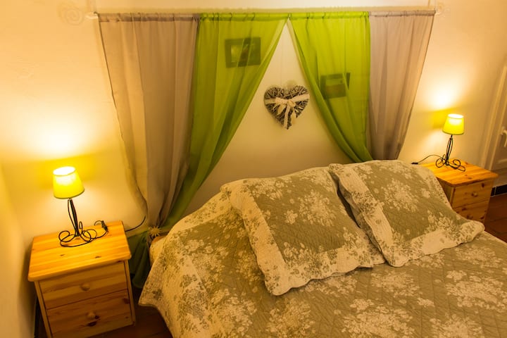 The queen bed in the master bedroom.