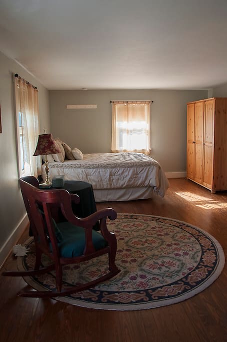 suite with queen bed and private bathroom with TV and DVD player