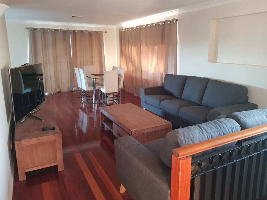 View of the lounge & dinning. Features a large smart TV and free internet