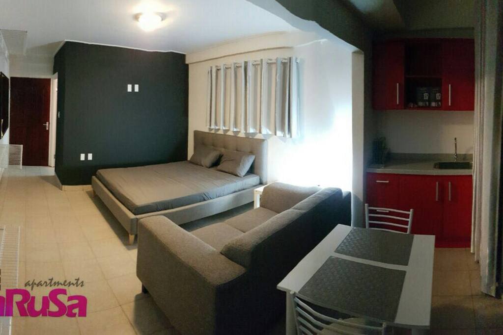 The apartments have all facilities included. Here the bed, relax couch and kitchen. Not in the pictures is the bathroom with your private shower and toilet