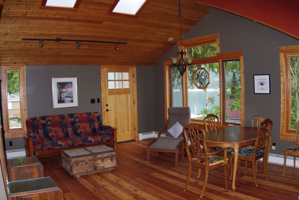 Upper floor entranceway, living, and dining area.