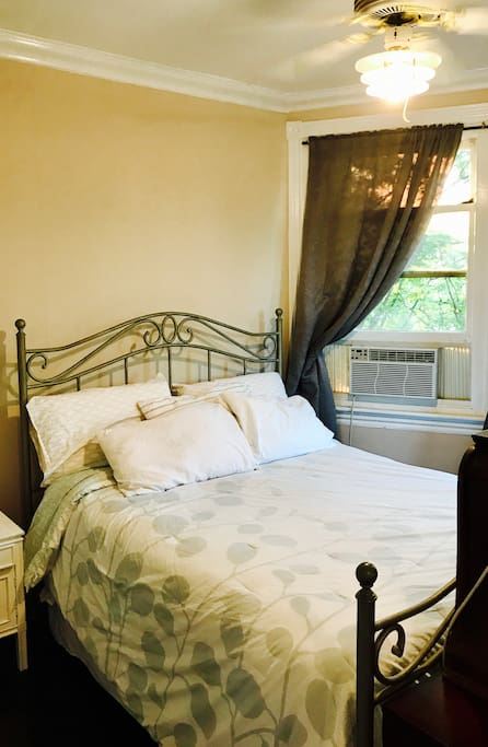 Private room- complete with TV, directly next to apartment entrance and full bathroom, near kitchen and a full view of State Street.