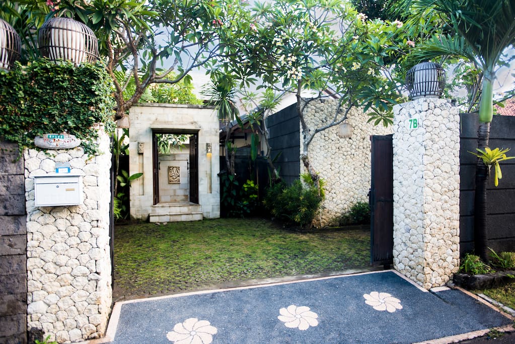 The entrance and parking space