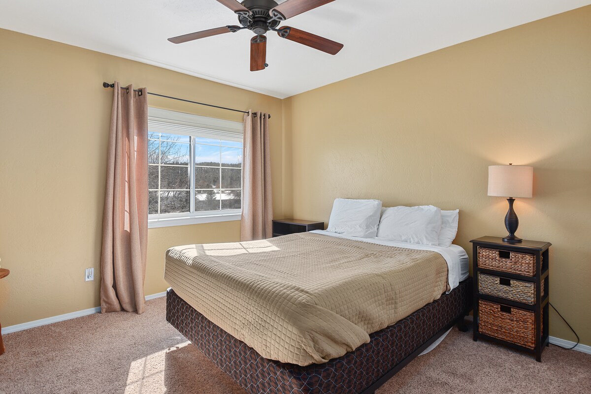 Upstairs bedroom #2 with a queen bed and a closet. 