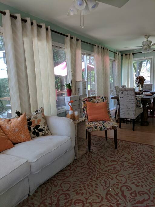 Light filled sunroom. It has windows with screens all around. Easy pop-through window to the kitchen for quick entertaining.