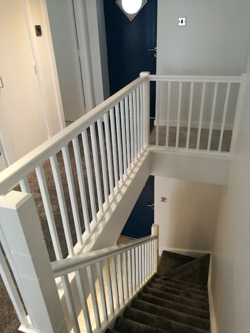 Stairs leading to the bedrooms and bathroom