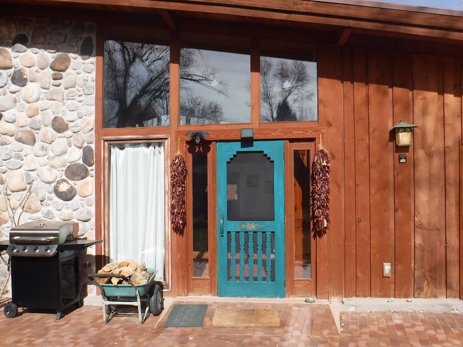 front door with ristras and gas grill