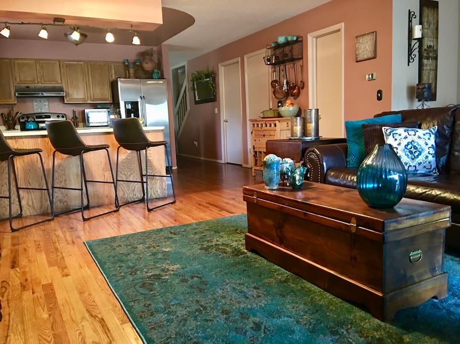 Charming Living Room Looking into Kitchen and Bar
