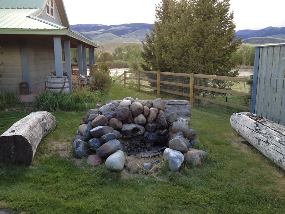 Out door fire pit with log seating.