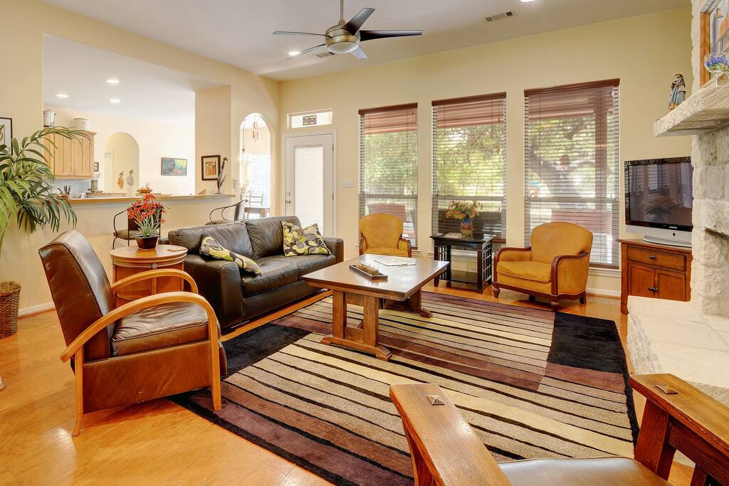 The main living area is opposite to the kitchen. The main living area has a door to the outside and a 38 inch Samsung flat screen TV.