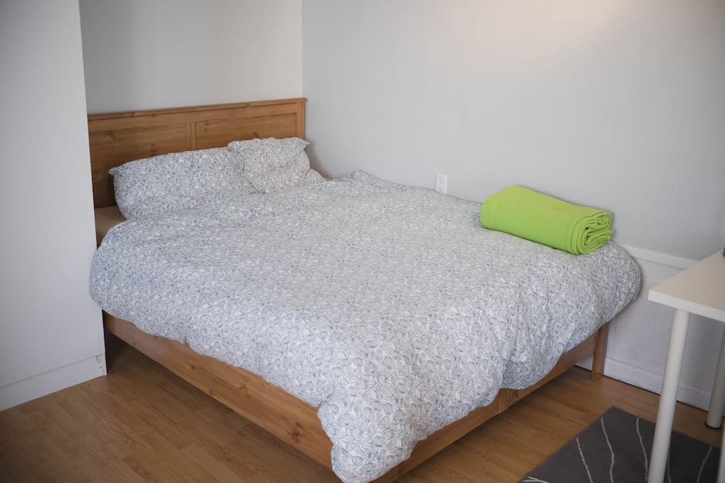 Queen sized bed with comfortable mattress.