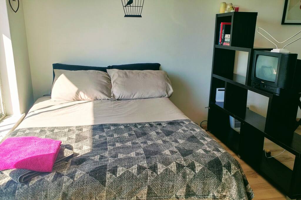 double bed next to windows