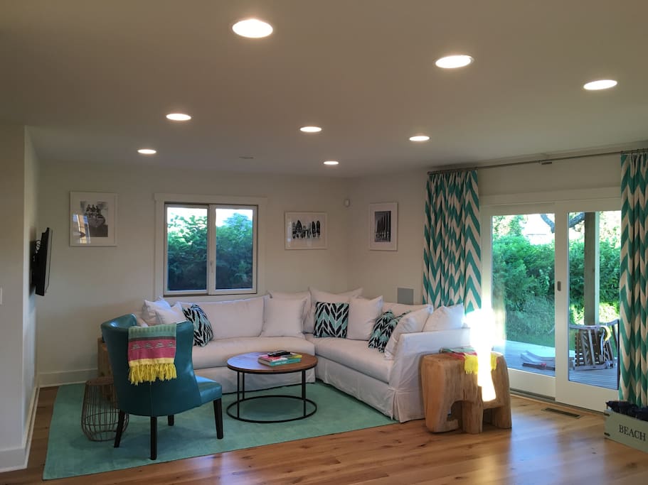 Lower level living room opens onto wrap-around porch.