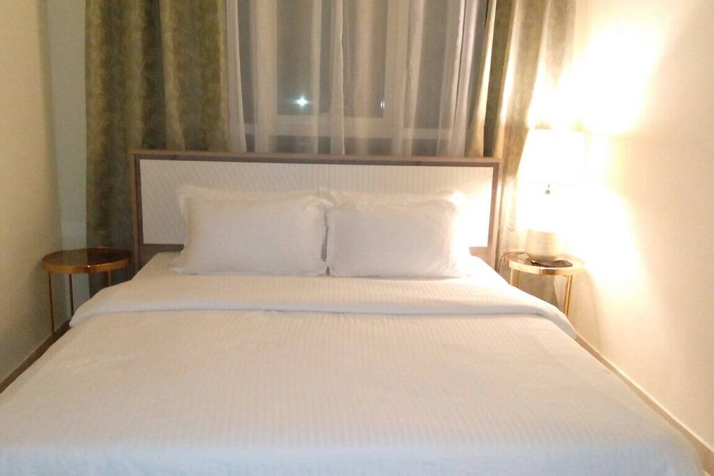 King size bed in a master bedroom