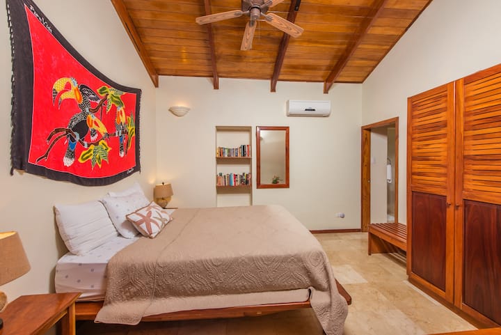 Front bedroom with ocean view. Featuring very comfortable sleeping space on your queen bed, and ensuite full bathroom. A/C and temperature control included.