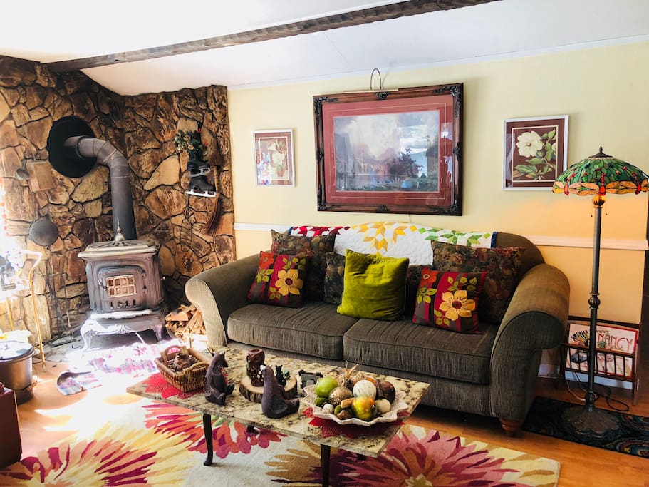 Front area room. Great for relaxing and reading a book while winter snow falls. Pot belly stoves warms the home quite well