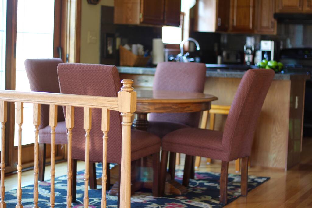 Eat-In Kitchen With Access to Backyard Patio and Grill