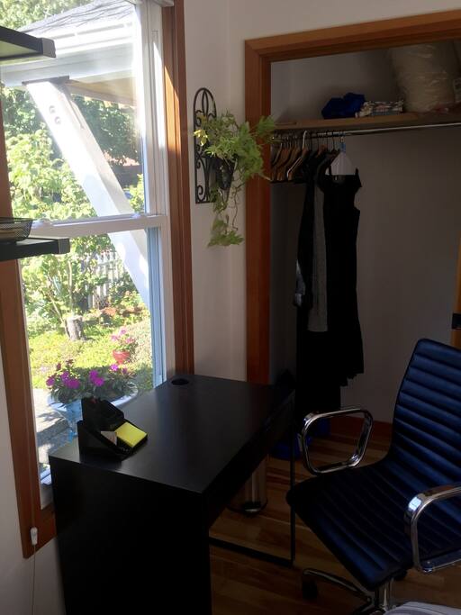 Desk with chair provided for guest use.