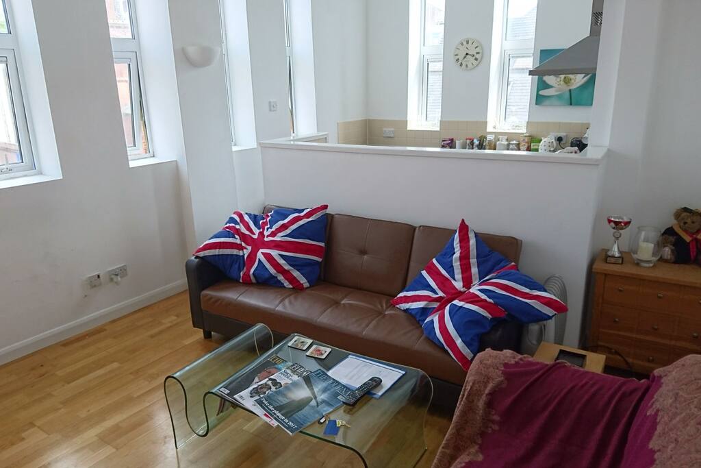 Sofa bed is the one with flag themed cushions
