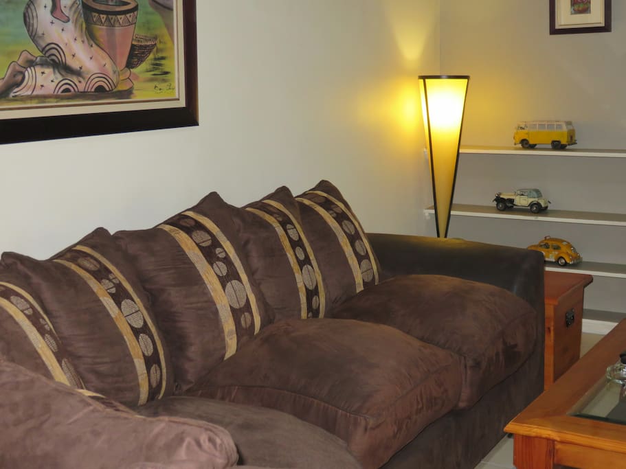 Lounge area with large TV and full DSTV and a fire place for the cold winter nights