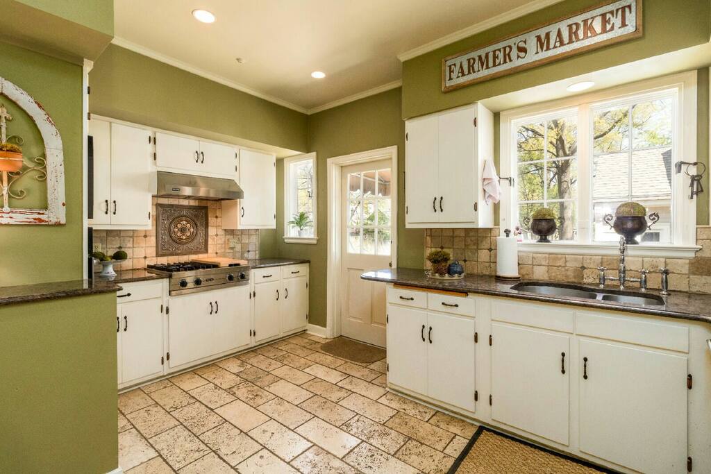 Kitchen stocked with pots, pans, dishes and silverware