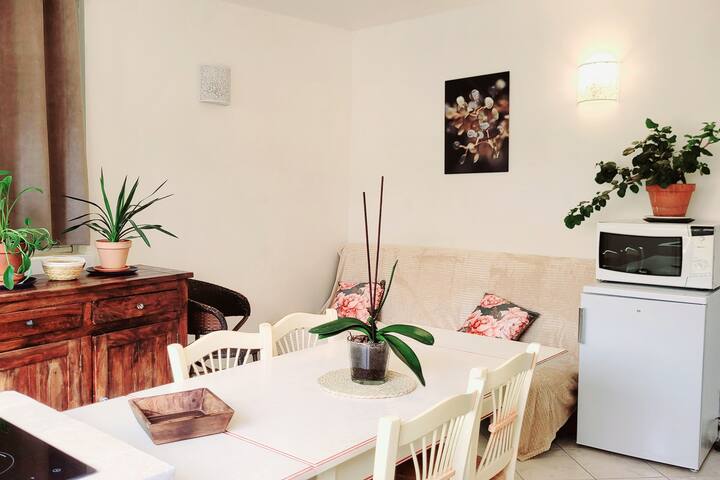 On the living room side, a sideboard has all the dishes you need.
One big click can become a bed. 
