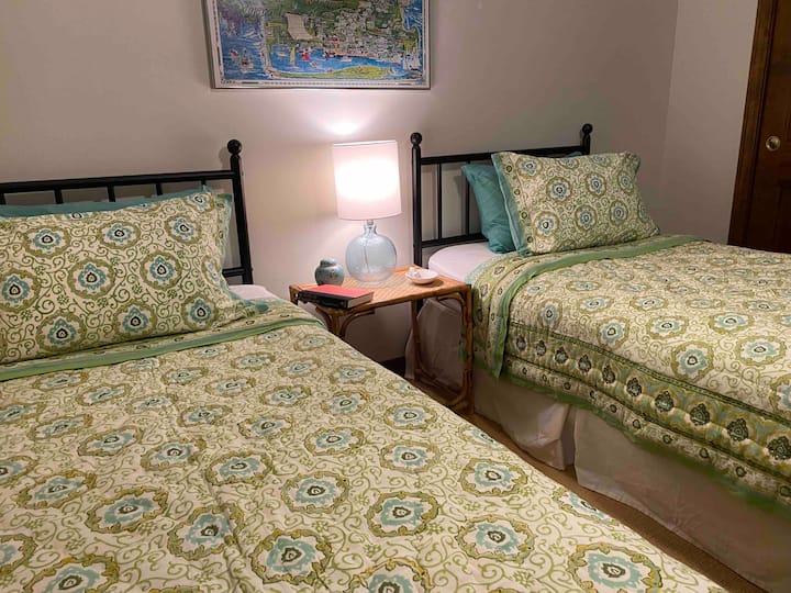 One of the two main floor bedrooms with two twin beds, closet and dresser. They share a bath across the hall.