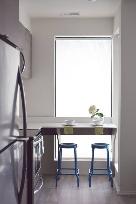 This dining nook is the ideal place to enjoy breakfast or a home cooked meal and a bottle of wine! :)