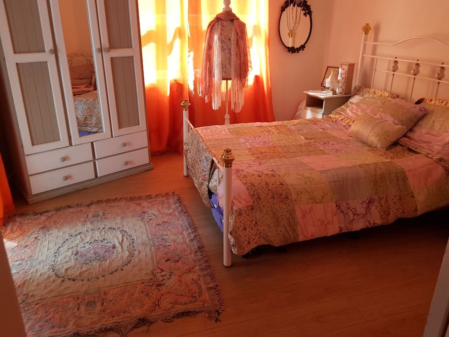 second bedroom ..french doors open onto private balcony
