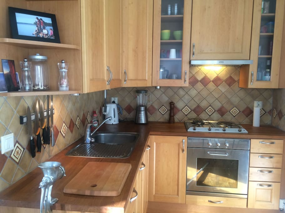 The delightful kitchen is equipped with a Smeg gas stove and the highest quality kitchenware.