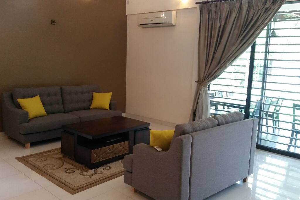 Open concept living area with high ceiling