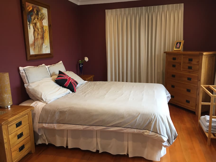 King Size Bed with garden views and a double wardrobe
